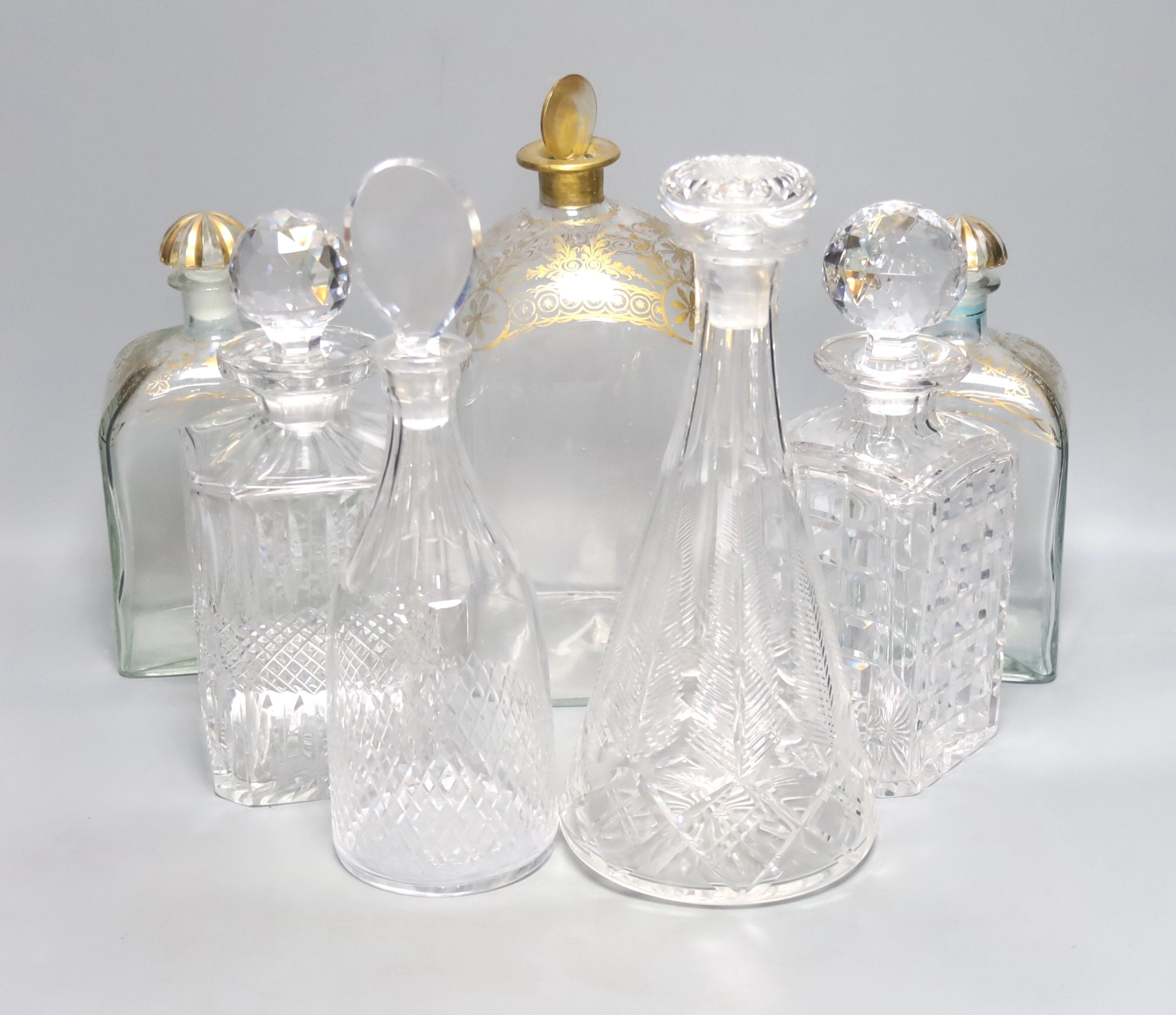 A Regency style decanter with lozenge-shaped stopper, a pair of gilt-decorated Spanish 'Jerez' decanters, a similar larger decanter and five other decanters